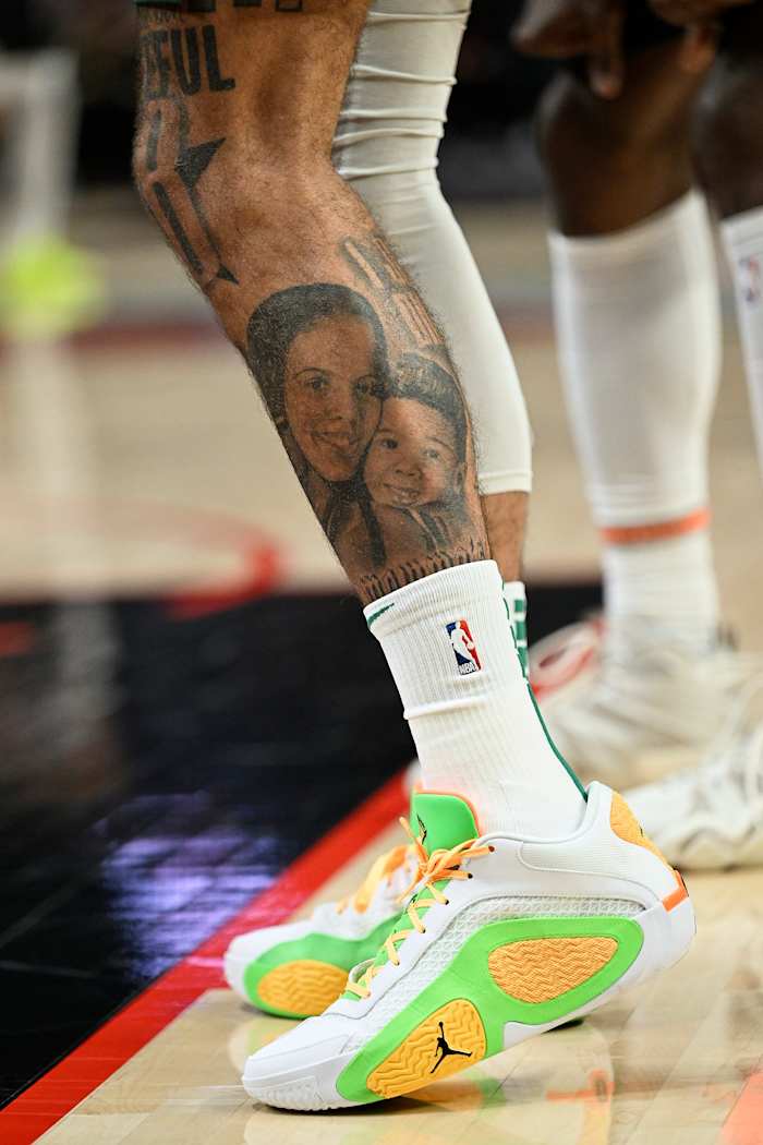 Boston Celtics forward Jayson Tatum's white and green Jordan Brand sneakers.